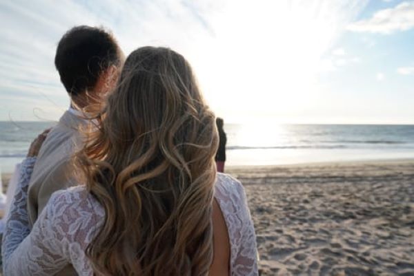 couples enjoying beach destination weddings